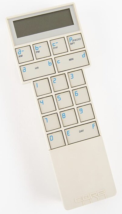 The CL-9 CORE remote: a cream plastic wand covered in numbered keys, looking very much like a pocket calculator